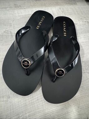 Coach Black Flip Flops with Gold Logo Medallions